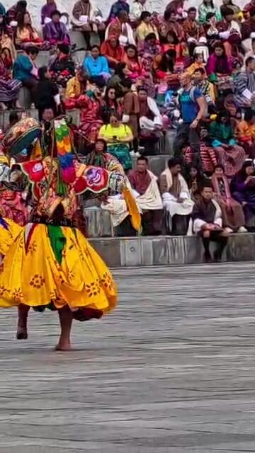 Masked dancer performing at Thimphu Tshechu